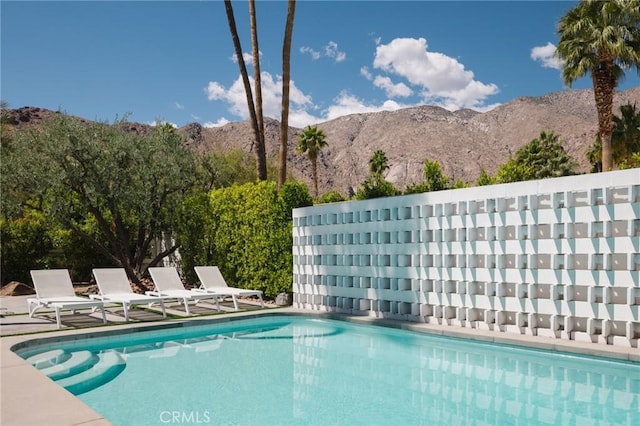 community pool featuring a mountain view