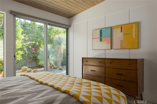 bedroom with wooden ceiling and access to exterior