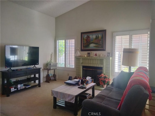 6353 Colonial Ave, Banning, CA 92220 - living area featuring carpet, lofted ceiling, and a brick fireplace
