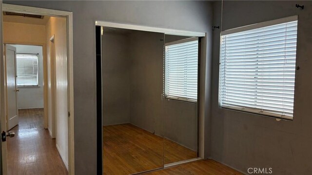 432 Oakford Dr, Los Angeles, CA 90022 - unfurnished bedroom featuring a closet and wood finished floors
