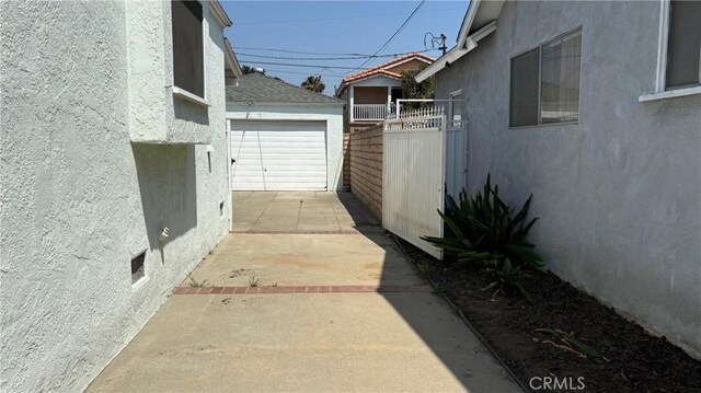432 Oakford Dr, Los Angeles, CA 90022 - view of patio / terrace featuring a garage and driveway