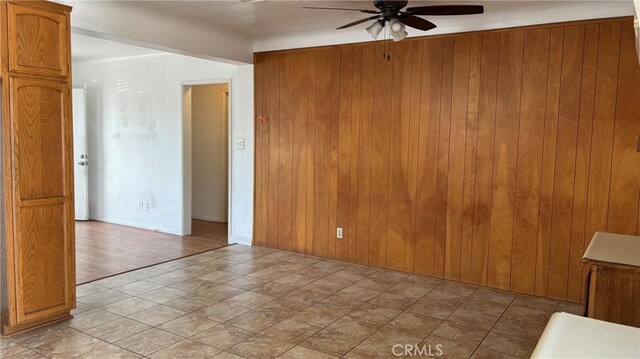 432 Oakford Dr, Los Angeles, CA 90022 - spare room with a ceiling fan and wooden walls