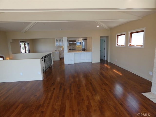304 27th St, Manhattan Beach, CA 90266 - unfurnished living room featuring dark wood finished floors and healthy amount of natural light