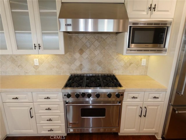 304 27th St, Manhattan Beach, CA 90266 - kitchen with wall chimney exhaust hood, appliances with stainless steel finishes, light countertops, and white cabinets