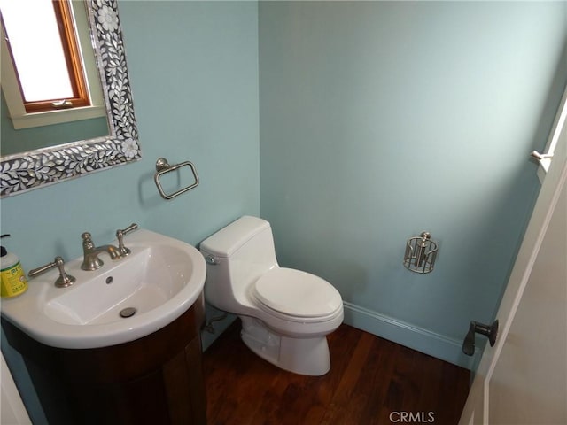 304 27th St, Manhattan Beach, CA 90266 - half bath featuring a sink, toilet, and wood finished floors