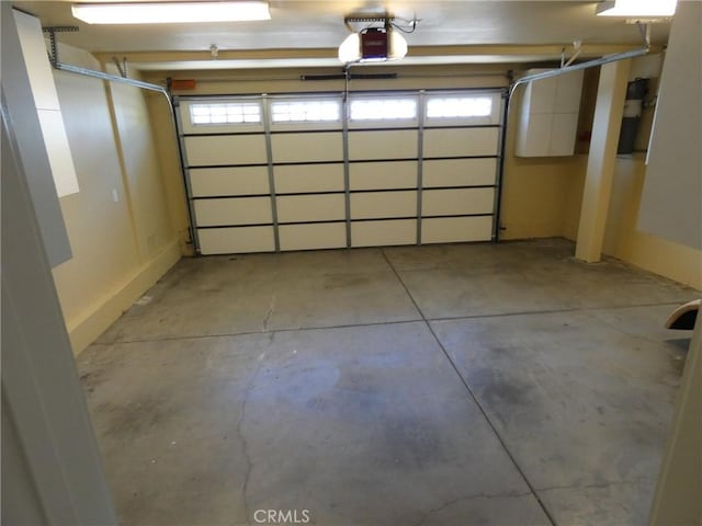 304 27th St, Manhattan Beach, CA 90266 - garage featuring a garage door opener
