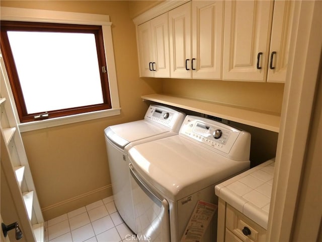 304 27th St, Manhattan Beach, CA 90266 - laundry area featuring cabinet space, washer and clothes dryer, light tile patterned floors, and baseboards