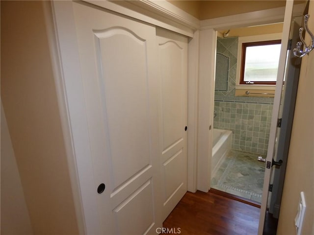 304 27th St, Manhattan Beach, CA 90266 - bathroom with tile walls, shower / tub combination, and wood finished floors