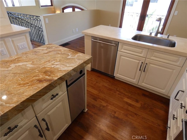 304 27th St, Manhattan Beach, CA 90266 - kitchen with dishwasher, dark wood-type flooring, white cabinetry, and light countertops