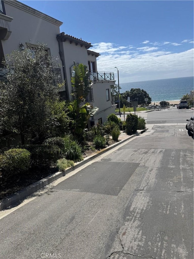 304 27th St, Manhattan Beach, CA 90266 - view of asphalt street with street lighting, a water view, and curbs