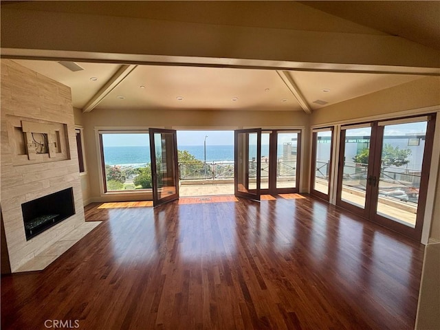 304 27th St, Manhattan Beach, CA 90266 - unfurnished living room featuring a fireplace, a water view, french doors, dark wood-style flooring, and baseboards