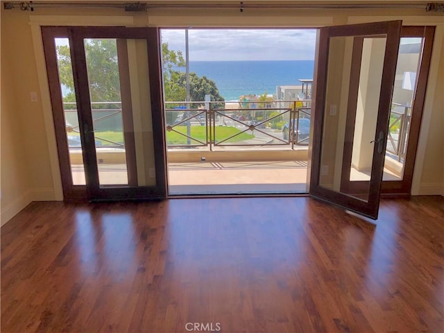 304 27th St, Manhattan Beach, CA 90266 - doorway to outside with wood finished floors and a water view