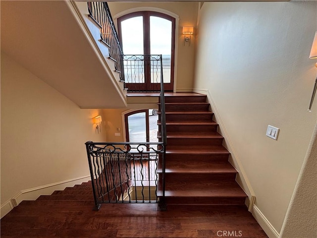304 27th St, Manhattan Beach, CA 90266 - stairway with arched walkways, wood finished floors, and plenty of natural light