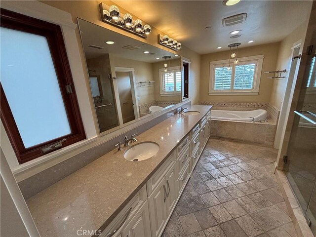 304 27th St, Manhattan Beach, CA 90266 - full bathroom featuring a garden tub, double vanity, stone tile floors, a stall shower, and recessed lighting