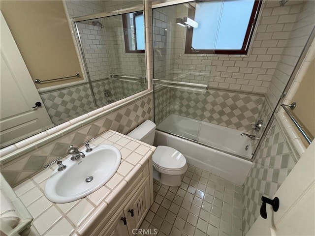 304 27th St, Manhattan Beach, CA 90266 - full bathroom with combined bath / shower with glass door, vanity, tile patterned floors, and tile walls