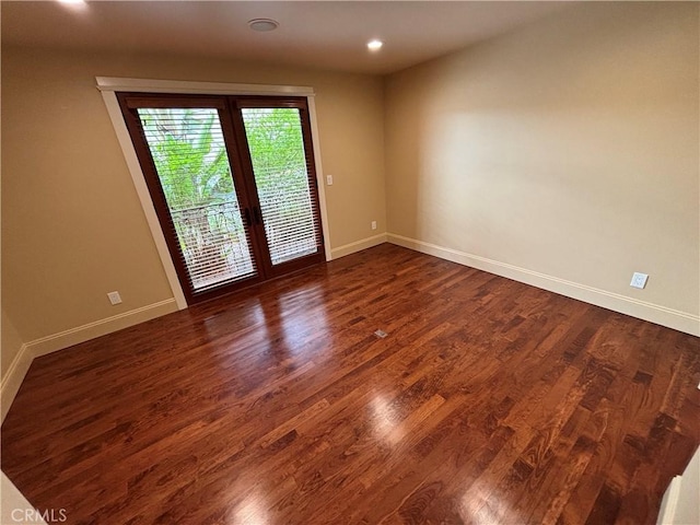 304 27th St, Manhattan Beach, CA 90266 - empty room featuring dark wood finished floors, french doors, and recessed lighting