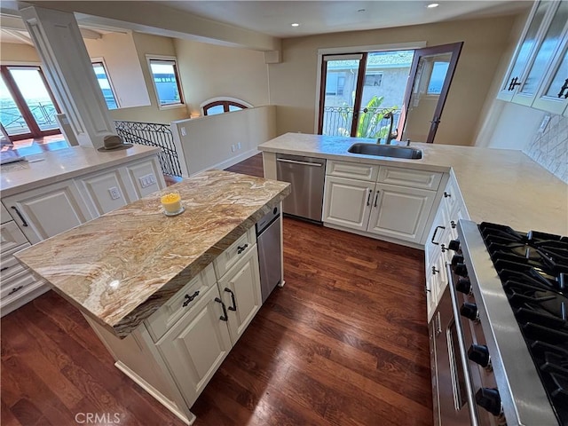 304 27th St, Manhattan Beach, CA 90266 - kitchen with dishwasher, stove, dark wood-type flooring, white cabinetry, and recessed lighting