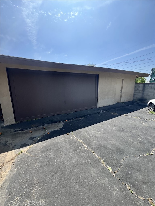 garage with fence