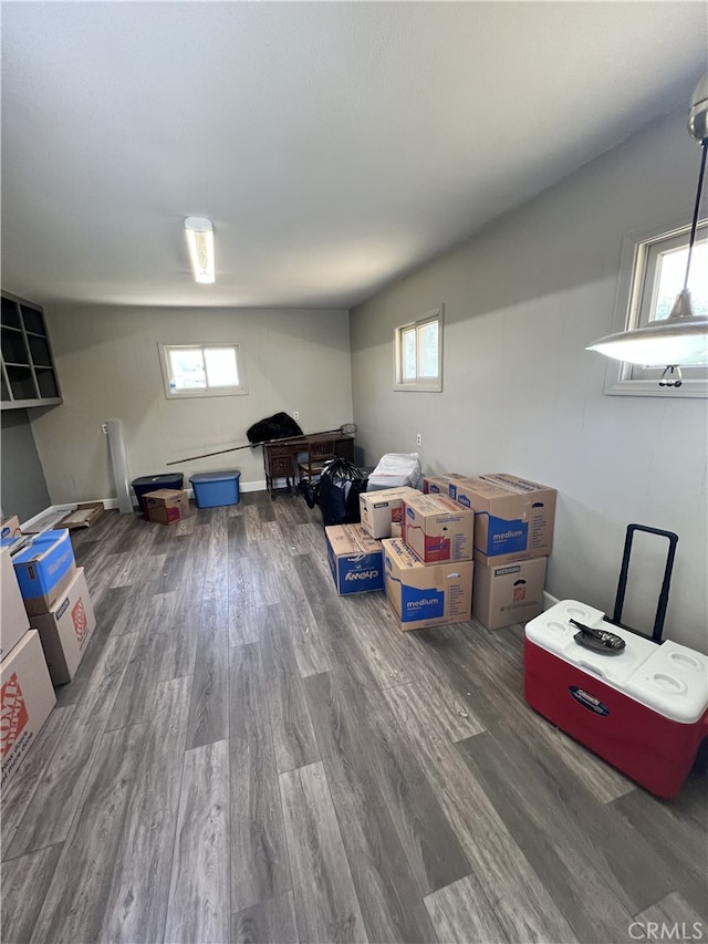 below grade area featuring a healthy amount of sunlight and wood finished floors