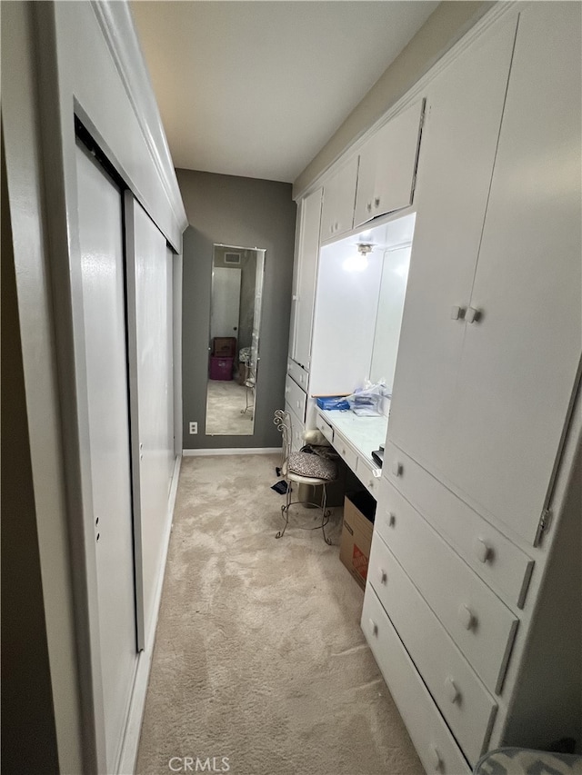interior space with vanity and baseboards