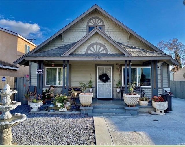 1329 W 3rd St, San Bernardino, CA 92410 - bungalow-style house featuring a porch and fence