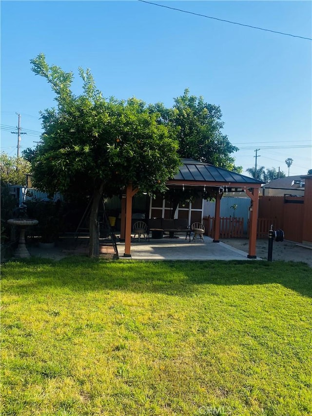 1329 W 3rd St, San Bernardino, CA 92410 - view of yard featuring a gazebo, fence, and a patio