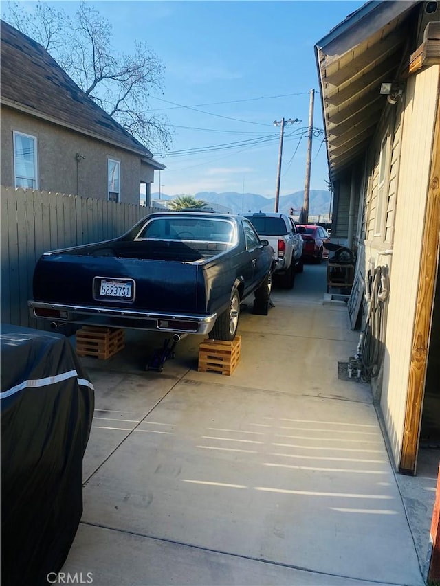 1329 W 3rd St, San Bernardino, CA 92410 - view of car parking with concrete driveway and fence