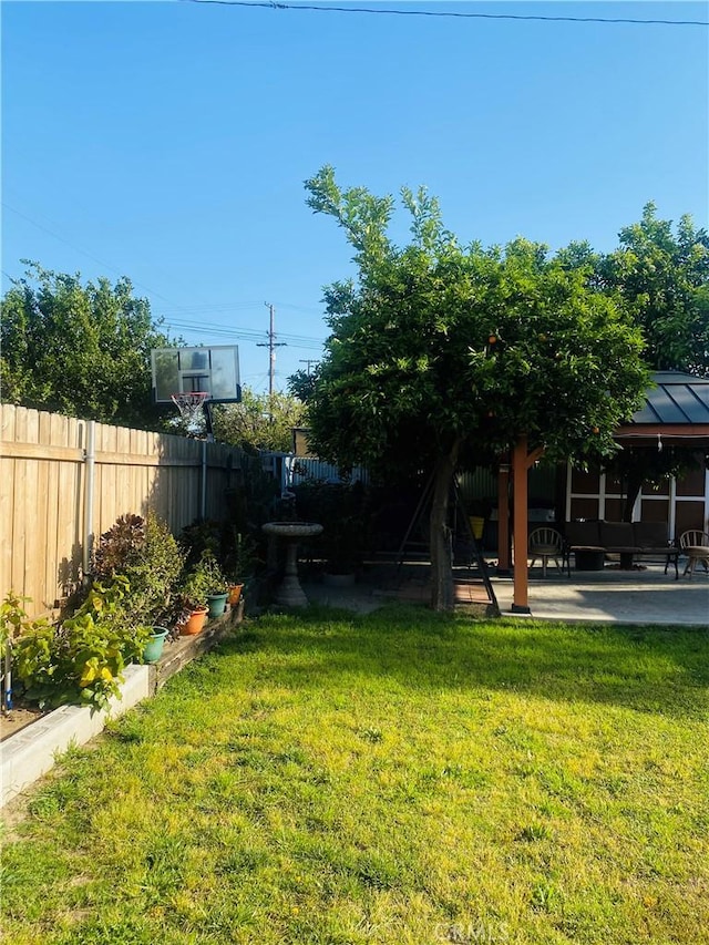 1329 W 3rd St, San Bernardino, CA 92410 - view of yard featuring a patio and fence
