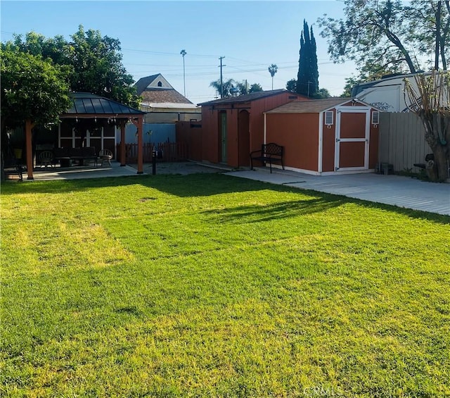 1329 W 3rd St, San Bernardino, CA 92410 - view of yard featuring a patio area, a gazebo, a storage shed, and an outdoor structure