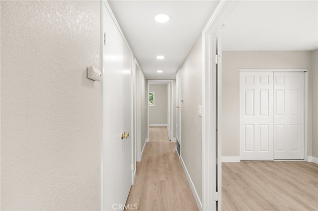 26497 Calle San Francisco Unit 60F, San Juan Capistrano, CA 92675 - hallway featuring recessed lighting, baseboards, and light wood-style flooring