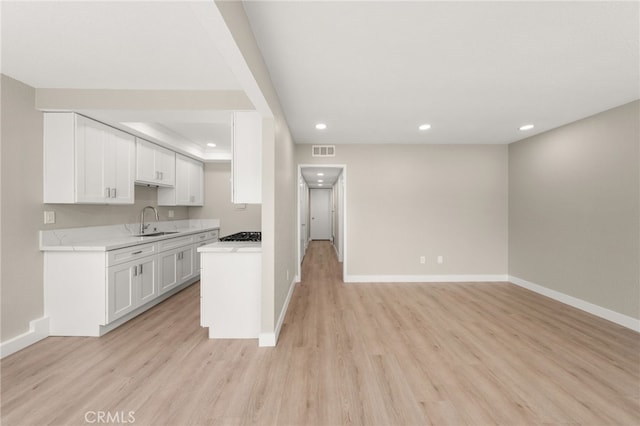 26497 Calle San Francisco Unit 60F, San Juan Capistrano, CA 92675 - kitchen with a sink, light countertops, recessed lighting, baseboards, and visible vents