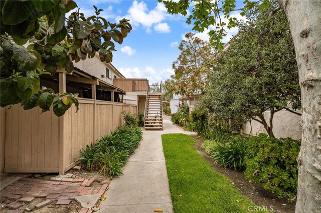 26497 Calle San Francisco Unit 60F, San Juan Capistrano, CA 92675 - view of yard featuring fence and stairs