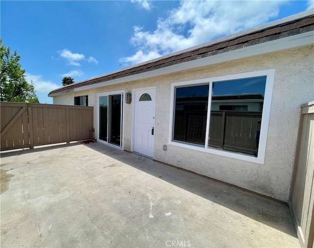 26497 Calle San Francisco Unit 60F, San Juan Capistrano, CA 92675 - rear view of property featuring a patio area, stucco siding, and fence