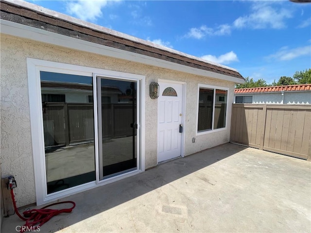 26497 Calle San Francisco Unit 60F, San Juan Capistrano, CA 92675 - entrance to property featuring a patio, fence, and stucco siding