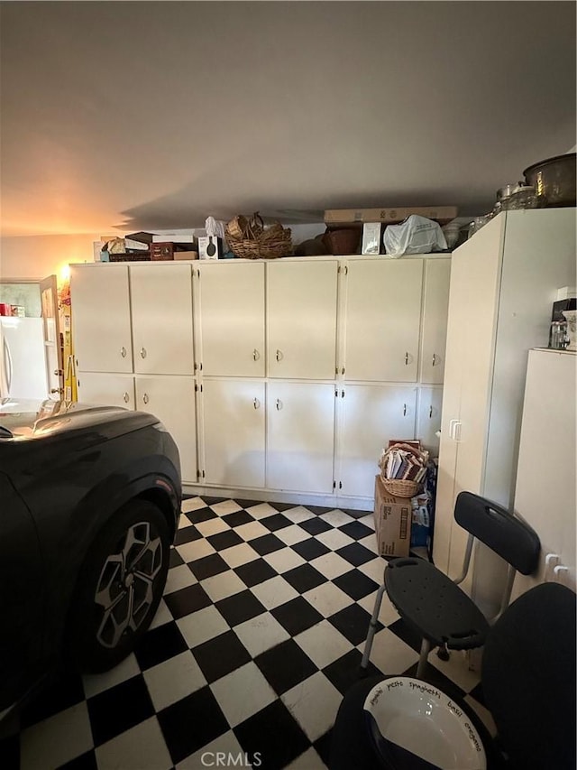 garage featuring freestanding refrigerator
