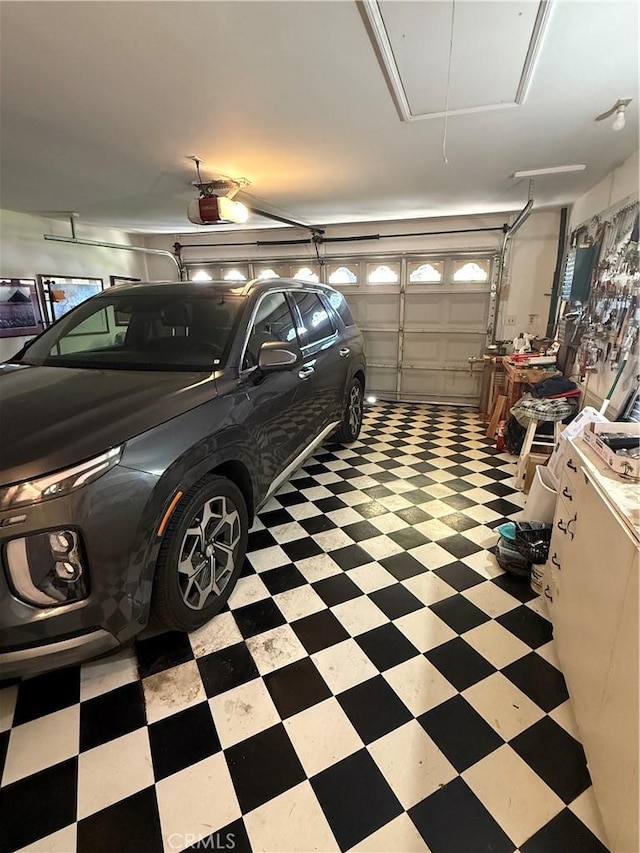 garage featuring a garage door opener