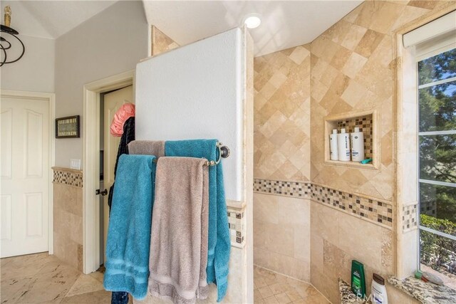 880 E 24th St, Upland, CA 91784 - full bath with tile walls, walk in shower, and plenty of natural light