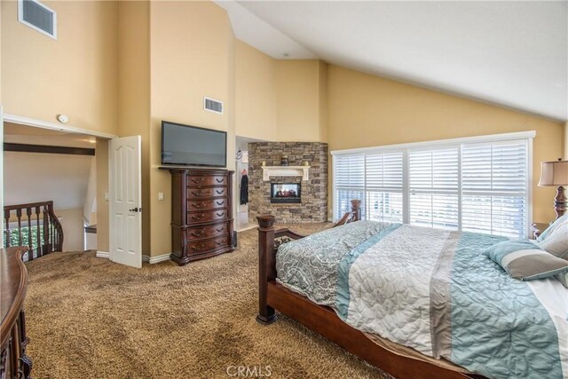 880 E 24th St, Upland, CA 91784 - carpeted bedroom with high vaulted ceiling, a fireplace, and baseboards
