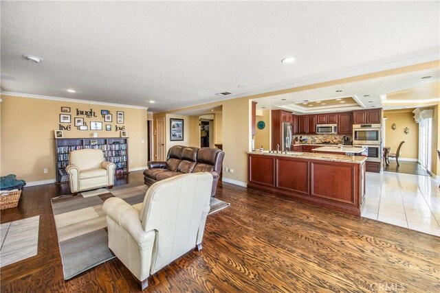 880 E 24th St, Upland, CA 91784 - living area featuring recessed lighting, baseboards, crown molding, light wood-style flooring, and a textured ceiling