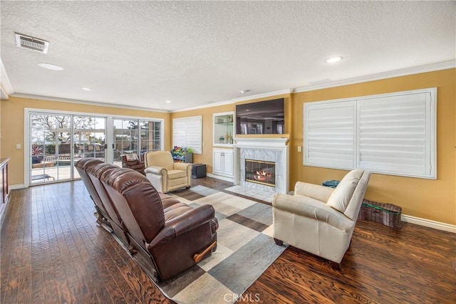 880 E 24th St, Upland, CA 91784 - living area with a textured ceiling, crown molding, hardwood / wood-style floors, a tile fireplace, and baseboards