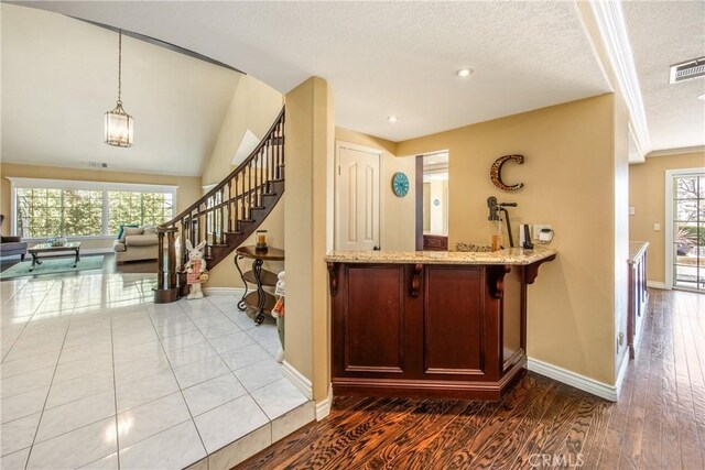 880 E 24th St, Upland, CA 91784 - bar area with baseboards, healthy amount of natural light, hanging light fixtures, stairs, and recessed lighting