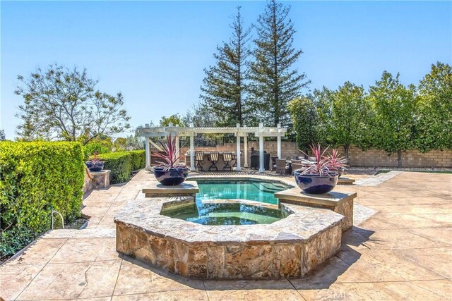 880 E 24th St, Upland, CA 91784 - view of swimming pool featuring a pergola, a patio, a fenced backyard, and a pool with connected hot tub