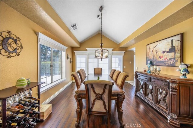 880 E 24th St, Upland, CA 91784 - dining area with a chandelier, lofted ceiling, dark wood-type flooring, and baseboards