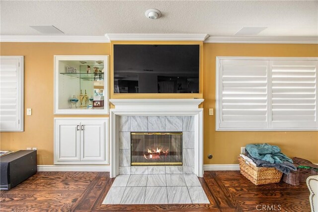 880 E 24th St, Upland, CA 91784 - living room with crown molding, baseboards, a tiled fireplace, wood finished floors, and a textured ceiling
