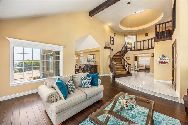 880 E 24th St, Upland, CA 91784 - living area featuring stairway, a chandelier, plenty of natural light, baseboards, and high vaulted ceiling