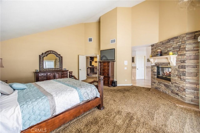 880 E 24th St, Upland, CA 91784 - bedroom featuring carpet floors, high vaulted ceiling, and a stone fireplace