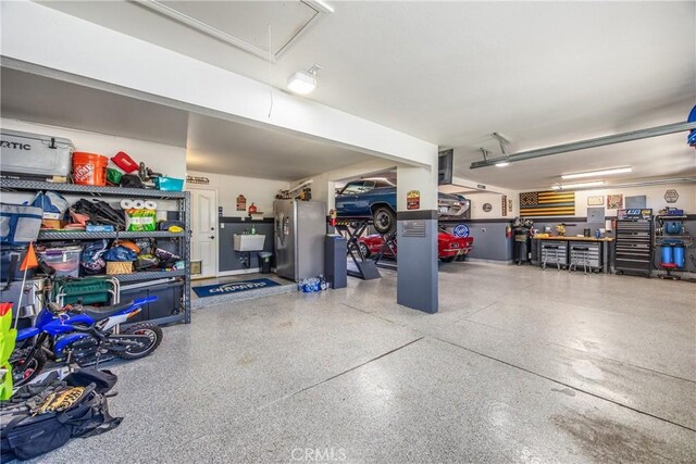 880 E 24th St, Upland, CA 91784 - garage with stainless steel refrigerator with ice dispenser