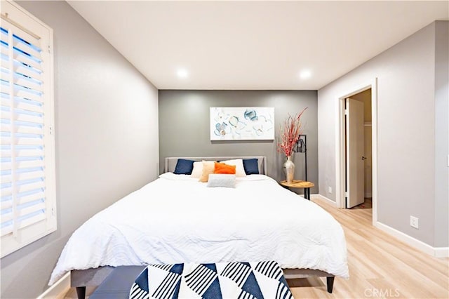 175 Huntington, Irvine, CA 92620 - bedroom with light wood-style flooring and baseboards