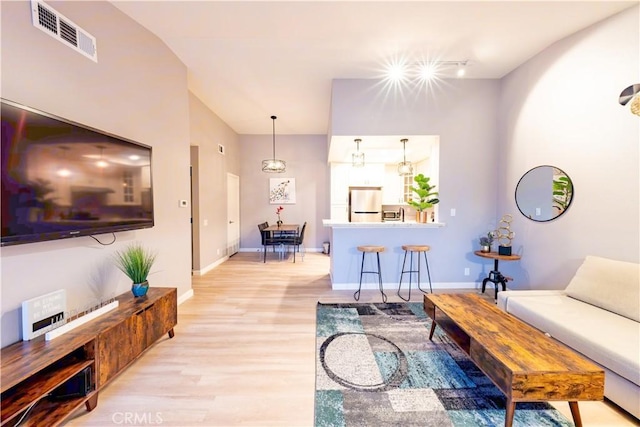 175 Huntington, Irvine, CA 92620 - living area featuring light wood-style floors, visible vents, and baseboards