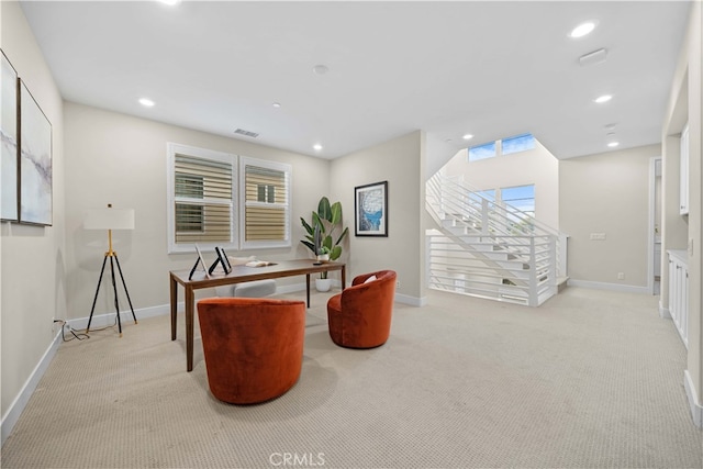 office area with visible vents, baseboards, recessed lighting, and light carpet